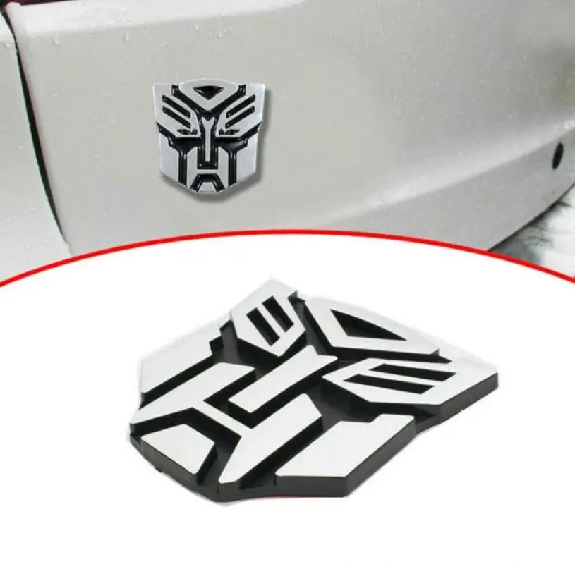3D Metal Car Emblem Badge – Transformer Logo (8x7cm) CHERRI BERRY BY GOLDEN SPARROW