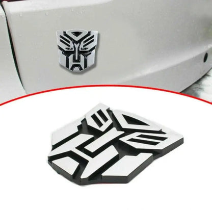 3D Metal Car Emblem Badge – Transformer Logo (8x7cm) CHERRI BERRY BY GOLDEN SPARROW