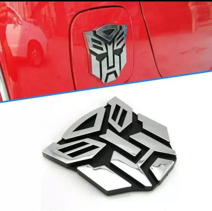3D Metal Car Emblem Badge – Transformer Logo (8x7cm) CHERRI BERRY BY GOLDEN SPARROW